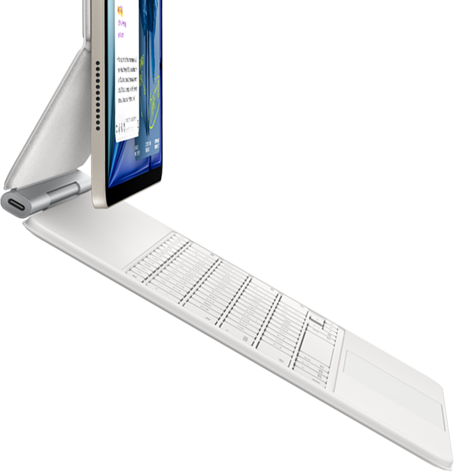 iPad Air, coloris lumière stellaire, fixé à un Magic Keyboard, blanc, vue latérale